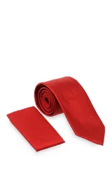 Corbata verde oscuro con estampado floral y pañuelo de bolsillo a juego.