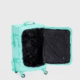 Valija mediana color verde menta con manija retráctil, dos compartimentos internos, correas de compresión y cuatro ruedas.
