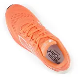 Championes de running New Balance 880 V14, color naranja con detalles en blanco y negro.