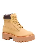 Bota Caterpillar modelo Colorado Max W, de color amarillo tostado, confeccionada en cuero con cuello acolchado en tono marrón oscuro. Cuenta con plataforma gruesa y suela dentada de goma.