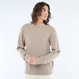 Sweater de tejido nido de abeja color beige, con cuello redondo, mangas largas y puños elastizados acanalados.