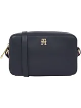 Cartera cruzada tipo bandolera Tommy Hilfiger de poliuretano color azul marino, con correa ajustable y logo metálico dorado en el frente.