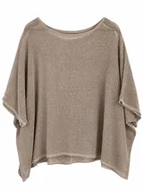 Poncho de tejido de punto calado color vison, con escote redondo y diseño amplio y liviano.