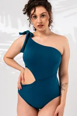 Malla enteriza de lycra azul petróleo, con un solo hombro y abertura lateral.