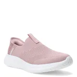 Championes deportivos Umbro modelo Flex Lady, de diseño slip-on sin cordones, confeccionados en tejido de punto elástico color rosado con suela blanca de goma texturizada.
