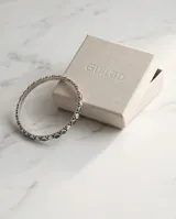 Pulsera esclava de plata 925 con diseño articulado, engastada con piedras naturales en tonos verde, violeta y circonias blancas brillantes.