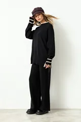 Pantalón de tejido rib de corte recto y holgado, con cintura elástica y diseño minimalista.