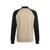 Campera adidas Originals SST de corte ajustado, con diseño de inspiración retro en color beige y mangas negras con las clásicas tres tiras blancas de la marca. Cuenta con escote bomber, cierre frontal completo y el logo del trébol bordado en el pecho.