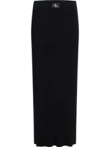 Falda larga negra de lyocell de canalé, con cintura elástica, abertura lateral y logo de Calvin Klein en la cintura.