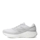 Championes de running New Balance modelo Evoz con tecnología Fresh Foam. Diseño en color gris claro con detalles en violeta y fucsia en la entresuela y logo de la marca.