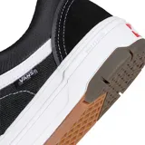 Championes Vans modelo Skate Old Skool con tecnología Wafflecup, color negro con detalles en blanco. Presentan una combinación de materiales en la capellada, cordones blancos, la icónica banda lateral de Vans y una suela de goma resistente con diseño de waffle.