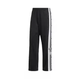 Pantalon deportivo Adidas modelo Adibreak, color negro con franjas laterales blancas y botones a presion a lo largo de las piernas. Presenta el logo de la marca y el emblema de la coleccion en el lateral.