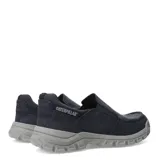 Zapatos tipo slip-on Caterpillar modelo Threshold, confeccionados en lona resistente color azul marino. Presentan un diseño de estilo casual con costuras reforzadas, elásticos laterales para un calce fácil y una suela de goma robusta en color gris con el logo de la marca en la puntera.
