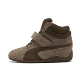 Championes Puma modelo Speedcat Wedge Wns, de caña alta y diseño con taco oculto, color marrón chocolate. Confeccionados en gamuza, incluyen cordones, tira de velcro con el logo grabado en el empeine y suela de goma inspirada en el automovilismo.