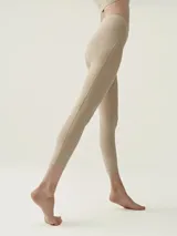Calza larga color beige de tejido Shapplex_B con costuras laterales y cintura alta.