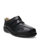 Zapato casual de cuero negro con cierre de doble velcro, diseñado para ofrecer comodidad y soporte, con suela ergonómica y costuras reforzadas.