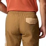 Pantalón cortavientos Columbia de color marrón, con tecnología Omni-Shield de repelencia avanzada a la lluvia y las manchas, cintura elástica ajustable y bolsillos con cierre en los laterales.