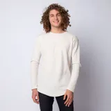 Buzo de manga larga con cuello redondo, confeccionado en tela tipo waffle de color beige. Presenta un corte long-fit con ruedo redondeado, ofreciendo un estilo relajado y moderno.