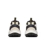 Championes Merrell modelo Speed Strike 2 Trek, con diseño técnico para senderismo y uso urbano. Presenta una combinación de malla transpirable, ante y materiales sintéticos en tonos beige, negro y detalles en amarillo vibrante. Cuenta con entresuela de espuma EVA para mayor estabilidad y suela de goma con relieve para un agarre superior.