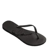 Sandalias tipo ojotas Havaianas modelo Slim Glitter II, color beige arena, con tiras finas cubiertas de glitter brillante.