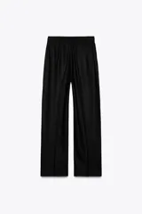 Pantalón azul marino de lino, de tiro alto con cintura elástica ajustable con cordones, bolsillos delanteros y pernera recta.