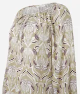 Blusa de manga larga con estampado geométrico en tonos verdes y violetas, cuello redondo con detalle de amarre frontal y puños elásticos.