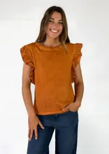 Remera de algodón negro con efecto acid wash, sin mangas y con volados fruncidos en los hombros.