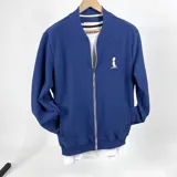 Campera bomber azul Francia de algodón tipo waffle con cierre frontal y logo mediano bordado en color natural.