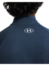 Buzo deportivo Under Armour Tech Textured de manga larga y cuello alto con medio cierre frontal, modelo 1382797. Confeccionado en tejido melange de color azul, cuenta con el logo de la marca estampado en el pecho en color blanco.