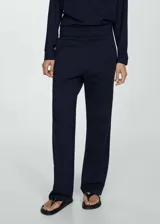 Pantalon de tiro alto con cintura elástica fruncida, diseño de corte recto y bolsillos laterales.