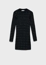 Vestido corto de punto fino en color negro, con diseño entallado, cuello perkins y manga larga. Presenta un estampado de strass brillante distribuido por toda la prenda.