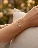 Pulsera doble de plata 925 con baño de oro y dije central en forma de ojo decorado con circonias multicolor y un detalle central esmaltado.