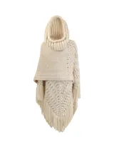 Poncho tejido a mano en lana merino color crudo, con capucha, cuello alto y flecos.