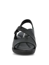 Sandalias de cuero negro con taco chino bajo de 4 cm, tira frontal ancha y cierre con velcro y tira ajustable en el talón.