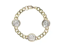 Pulsera dorada con cadena de eslabones gruesos y tres dijes circulares con cristales Swarovski Elements.