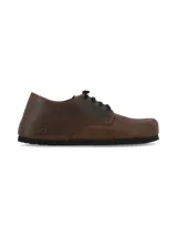 Zapato acordonado de cuero rústico color marrón con acabado natural y suela de EVA negra.