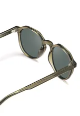 Lentes de sol redondos color champagne con lentes grises. Fabricados con acetato biodegradable y lentes de PMMA reciclado.