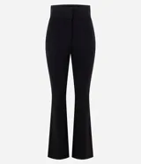 Pantalón flare negro de tiro alto, confeccionado en punto Roma con costuras frontales marcadas y botamanga acampanada.