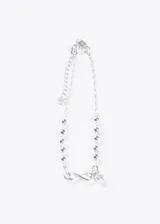 Pulsera de plata 925 con cadena de eslabones finos intercalados con pequeñas esferas plateadas. Incluye un dije con el símbolo de infinito y un pequeño dije colgante de cristal transparente.