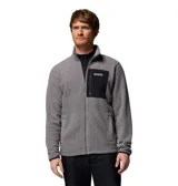 Campera de polar con cierre frontal completo, cuello alto y bolsillo en el pecho con cierre y revestimiento de contraste. Presenta puños y dobladillo con ribete elástico.