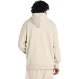 Buzo con capucha de felpa francesa color beige claro, con bolsillo canguro frontal y logo de New Balance estampado en el pecho.