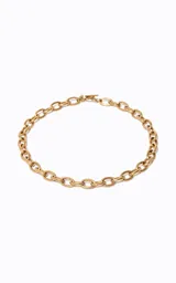 Collar dorado de metal con cadena gruesa de eslabones ovalados interconectados y acabado pulido.