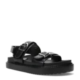 Sandalias de plataforma plana Miss Carol modelo Naira, color negro con doble tira ajustable con hebillas metálicas plateadas y suela dentada.