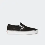 Championes Vans Classic Slip-On negros con suela blanca de goma.