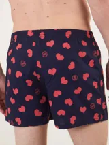 Bóxer de algodón blanco con estampado de flores pequeñas color celeste, con cintura elástica y logo de la marca en el centro.