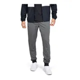 Pantalón de jogging Under Armour, color gris jaspeado, con cintura elástica ajustable con cordón, puños en los tobillos y bolsillos laterales con cierre. Presenta el logo de la marca estampado en la pierna derecha.
