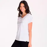 Remera blanca de algodón con cuello en V y logo de Caterpillar estampado en plateado.