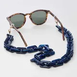 Correa para lentes azul con eslabones rectangulares de acrílico y terminales doradas.