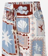 Short de cintura alta confeccionado en viscosa estampada con motivos tropicales. Tiene elástico y lazo en la cintura.