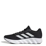 Championes de running Adidas modelo Switch Move, color negro con las tres tiras laterales en color plateado y entresuela blanca con diseño ondulado. Confeccionados en malla técnica transpirable con refuerzos sintéticos y suela de goma de alta resistencia.